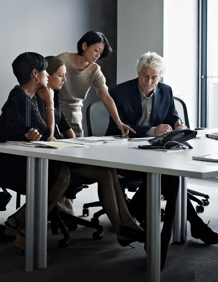 Executives around a conference room table